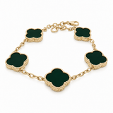 10K yellow gold bracelet with a large black clover charm